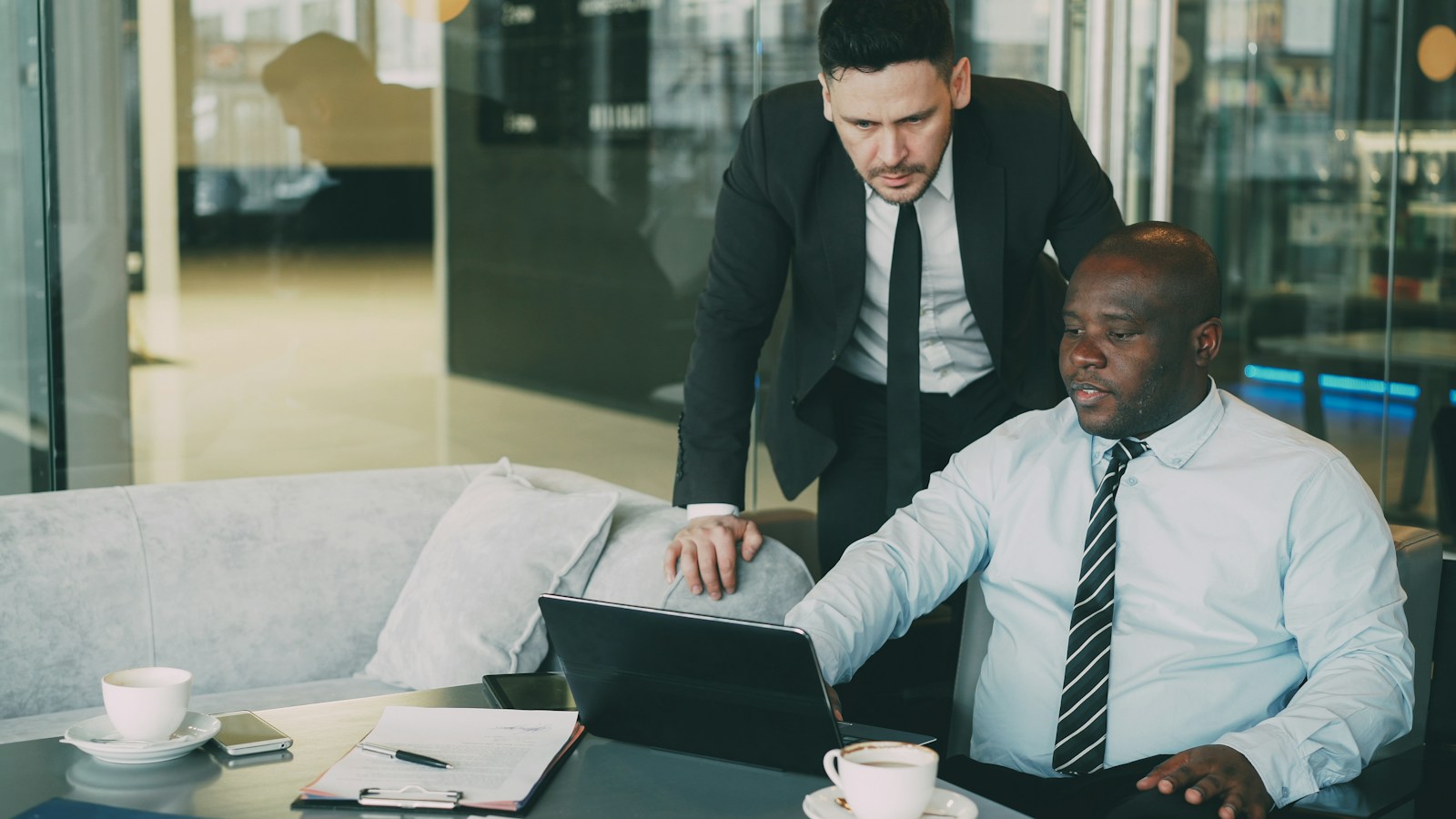 Business team working together on a laptop